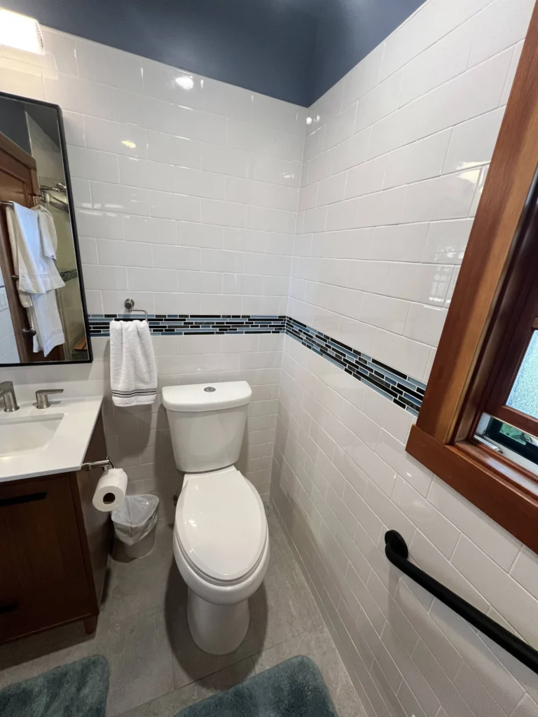 Bathroom remodel: Accessible bathroom with grab bar, white subway tile and glass mosaic band, Mill Valley