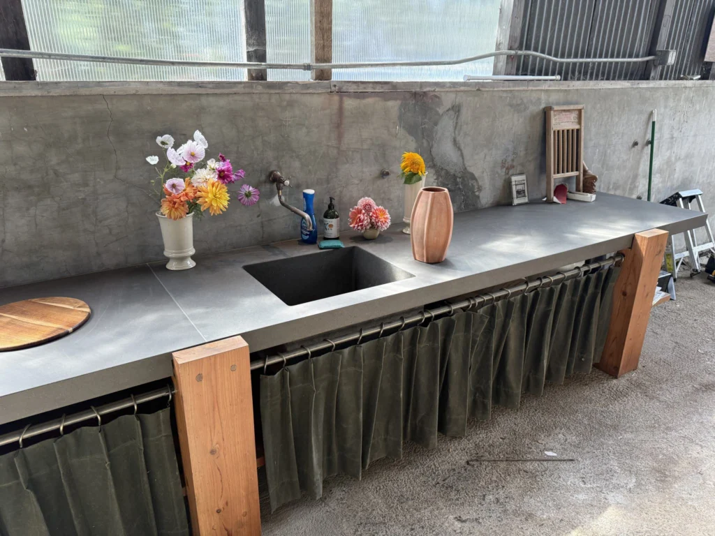 Whole-house remodel: Concrete potting counter with sink on redwood legs, Bolinas