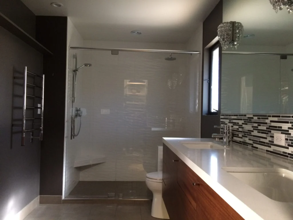 Bathroom remodel: Glass shower in white wave tile with a heated towel rail, Terra Linda