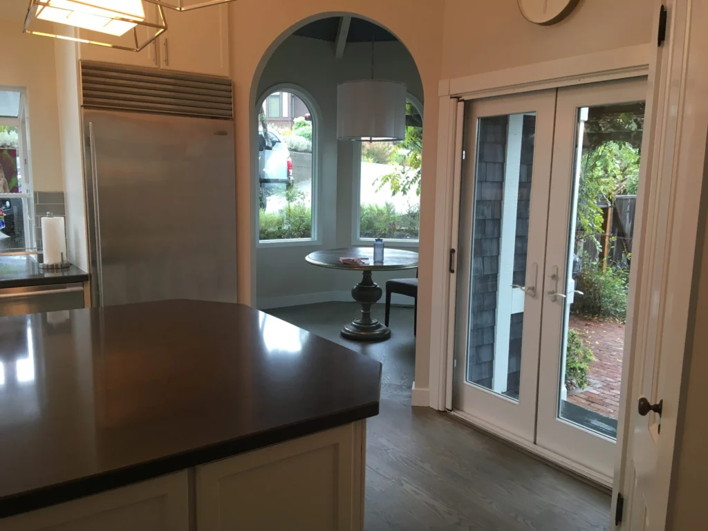 Flooring: Kitchen island, French doors and arched breakfast nook over dark oak floor, Tiburon