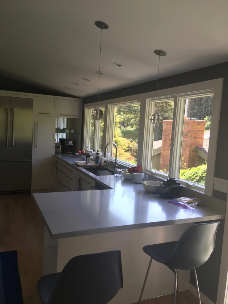 Kitchen remodel: Kitchen peninsula with bar stools and a wall of windows, Mill Valley