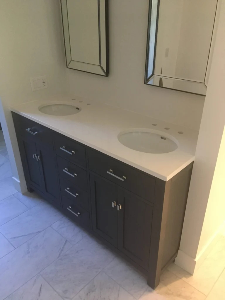 Bathroom remodel: Gray double vanity with white top and marble floor, Tiburon