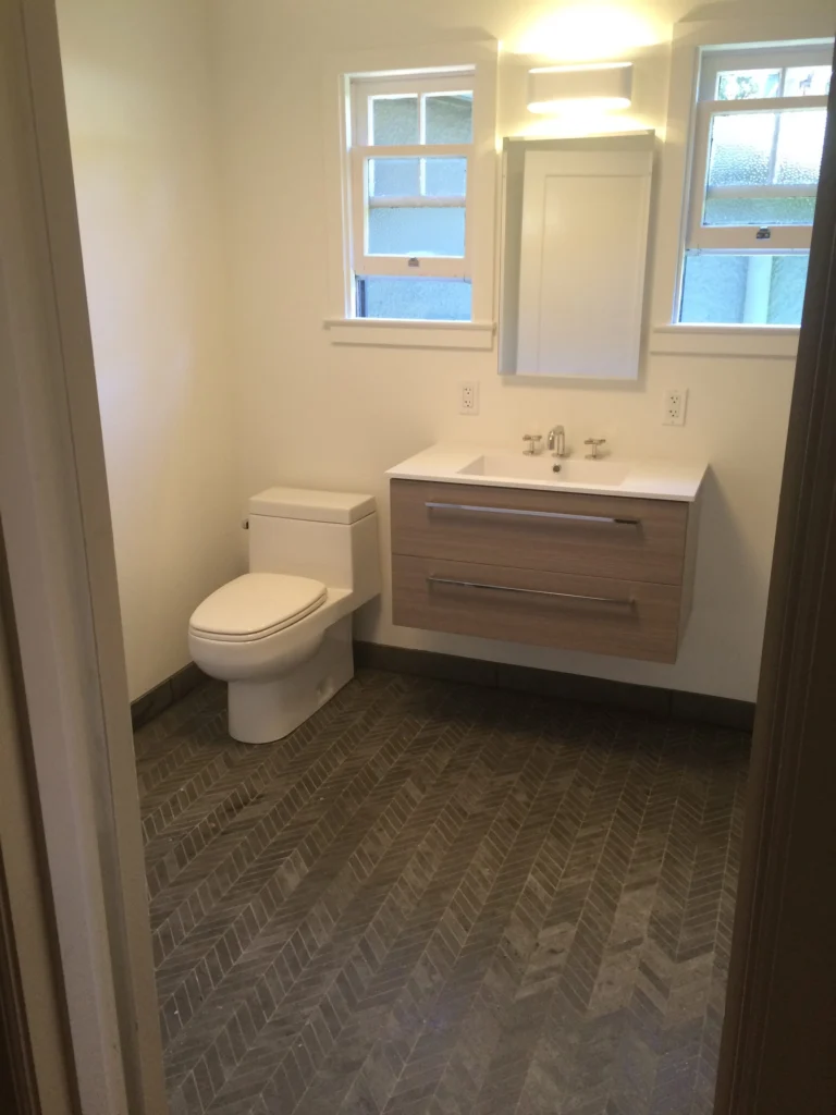 Bathroom remodel: Floating wood vanity, wall-hung toilet and herringbone floor, San Anselmo