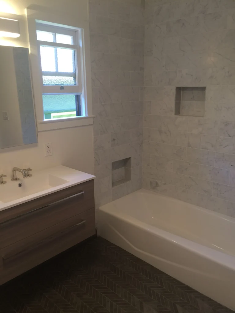 Bathroom remodel: Marble tub surround with niches and a floating vanity, San Anselmo