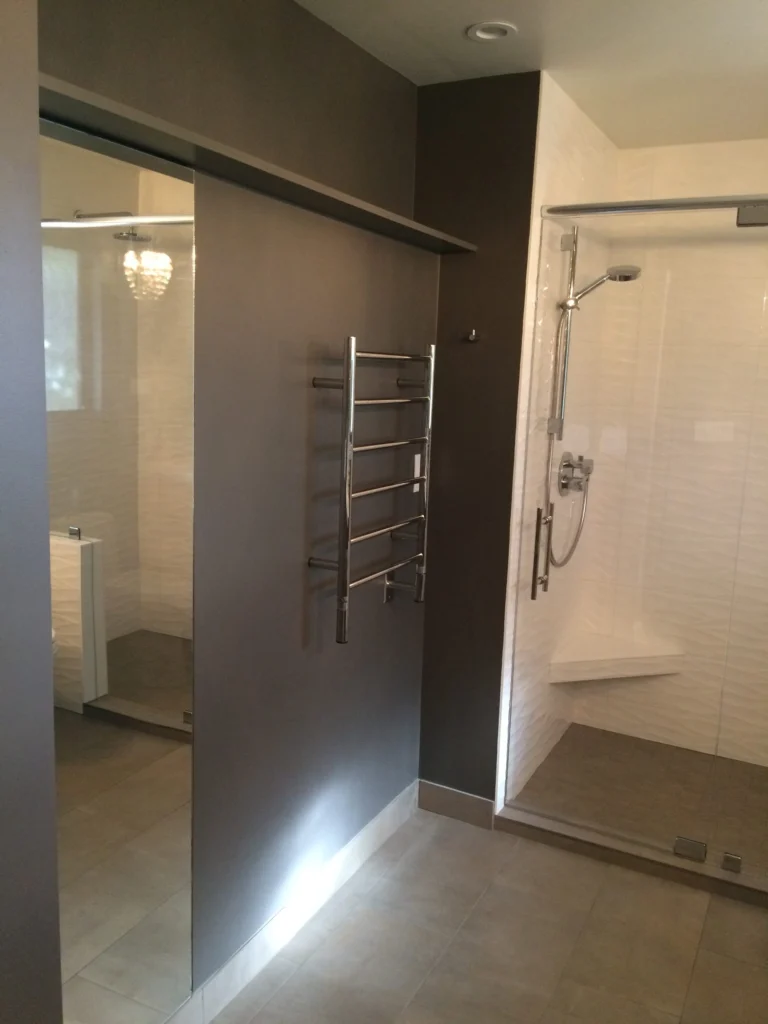 Bathroom remodel: Sliding door into the shower room, heated towel rail and wave tile, Terra Linda