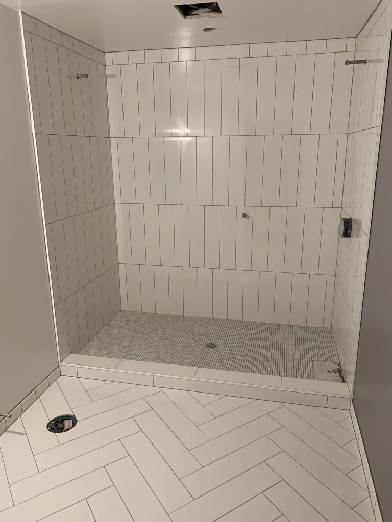 Bathroom remodel: White tile shower and herringbone floor, nearly done, San Rafael